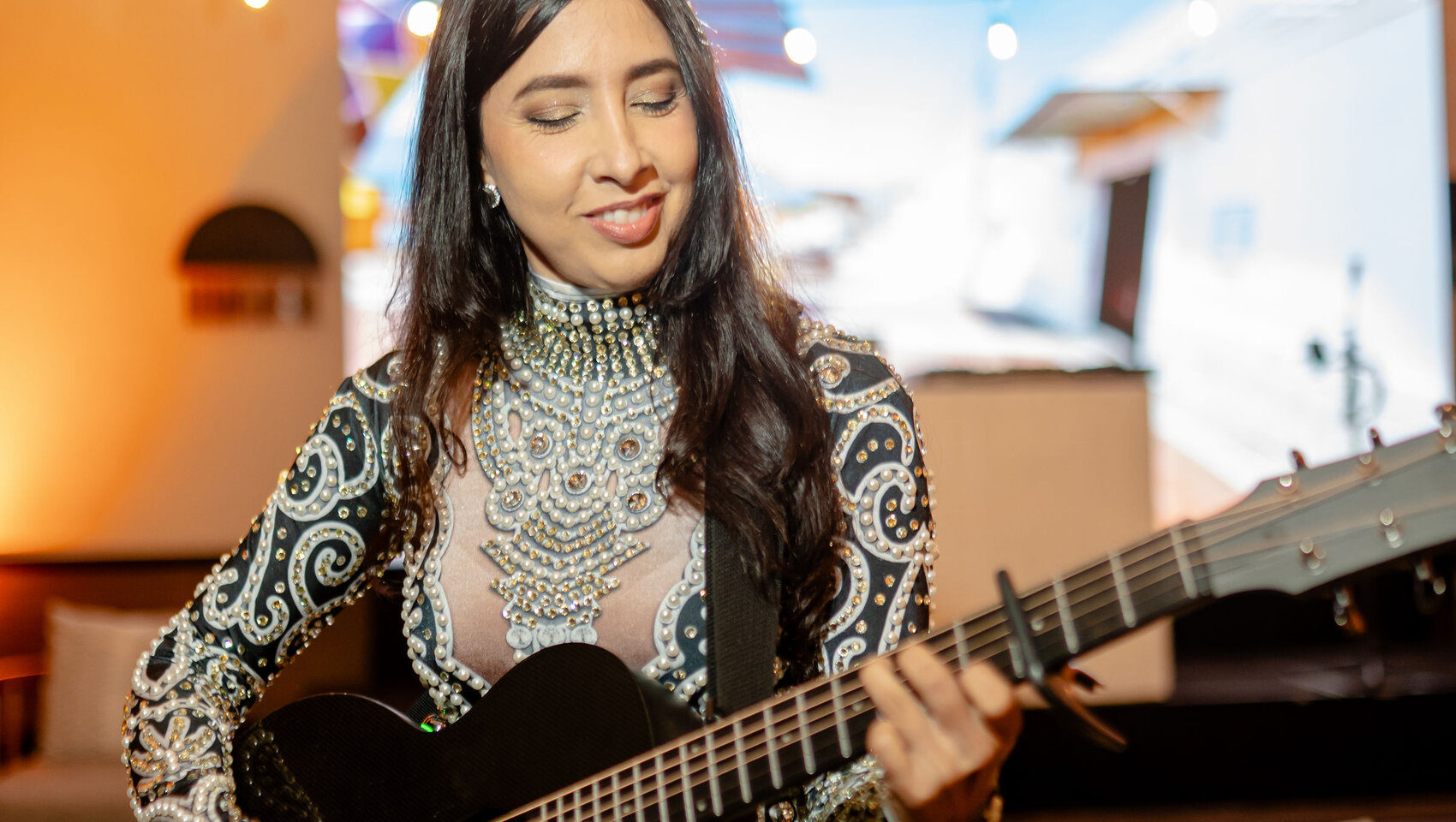 woman playing guitar Beer Festival at Grand Roatan