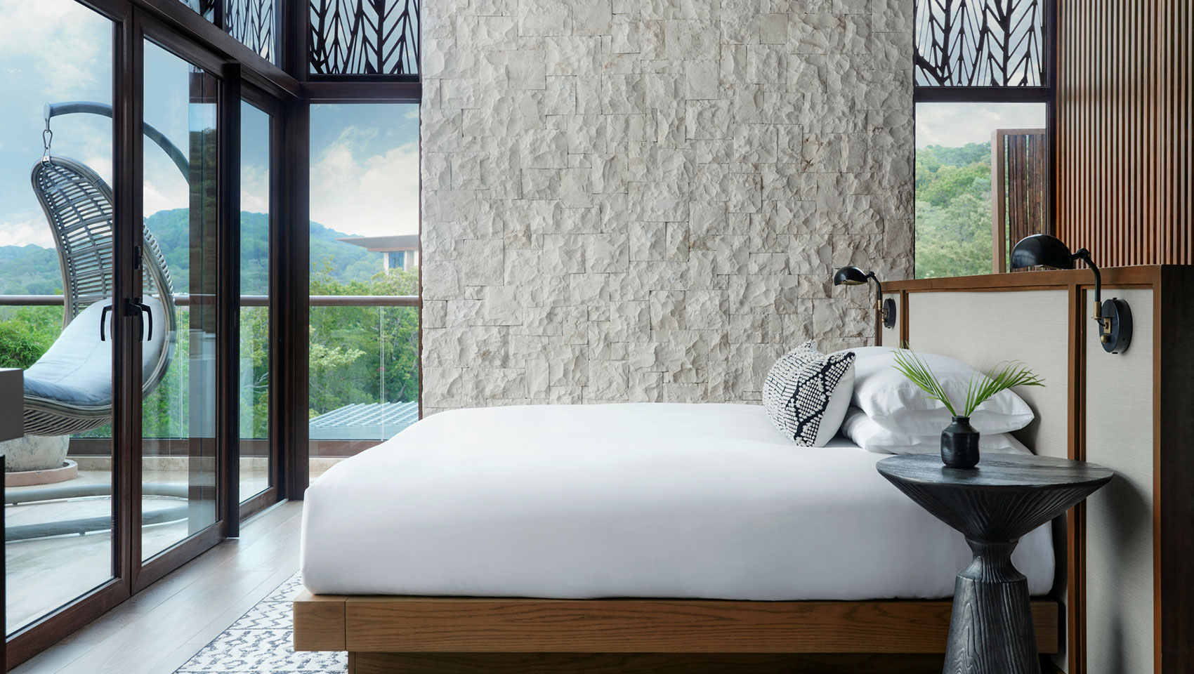 King bed with view in Spa Suite and Kimpton Grand Roatan