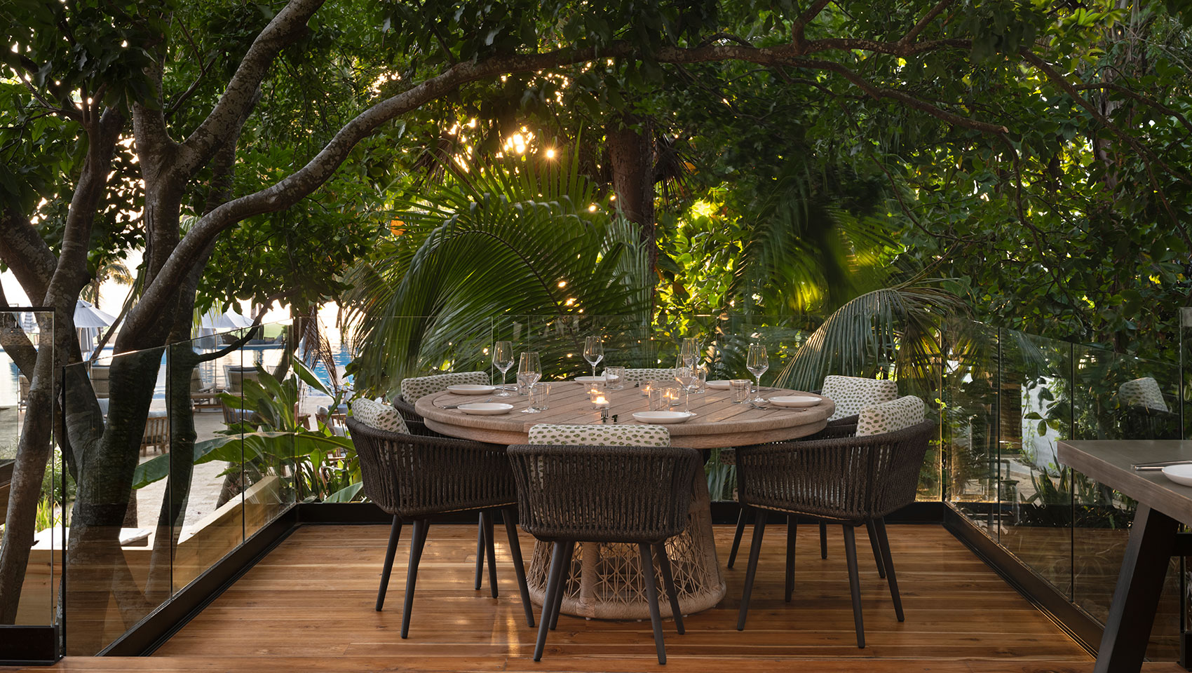 Picture of large outdoor table on alera patio covered in trees