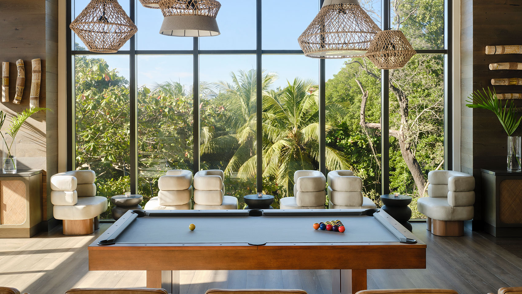 Vos Cafe & Bar Pool table in front of large window with jungle view