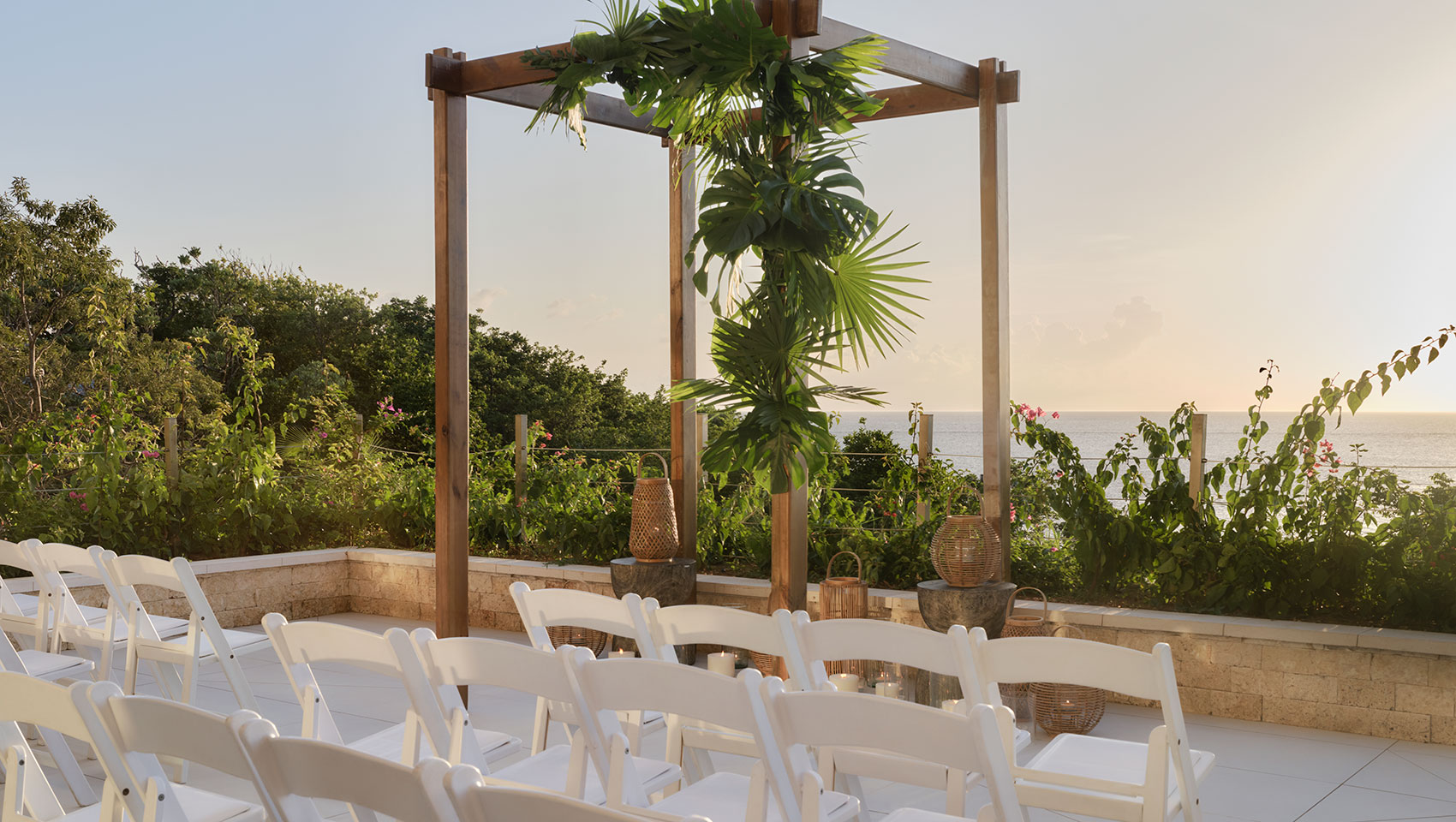 Roatan outdoor patio overlooking ocean with small ceremony set up