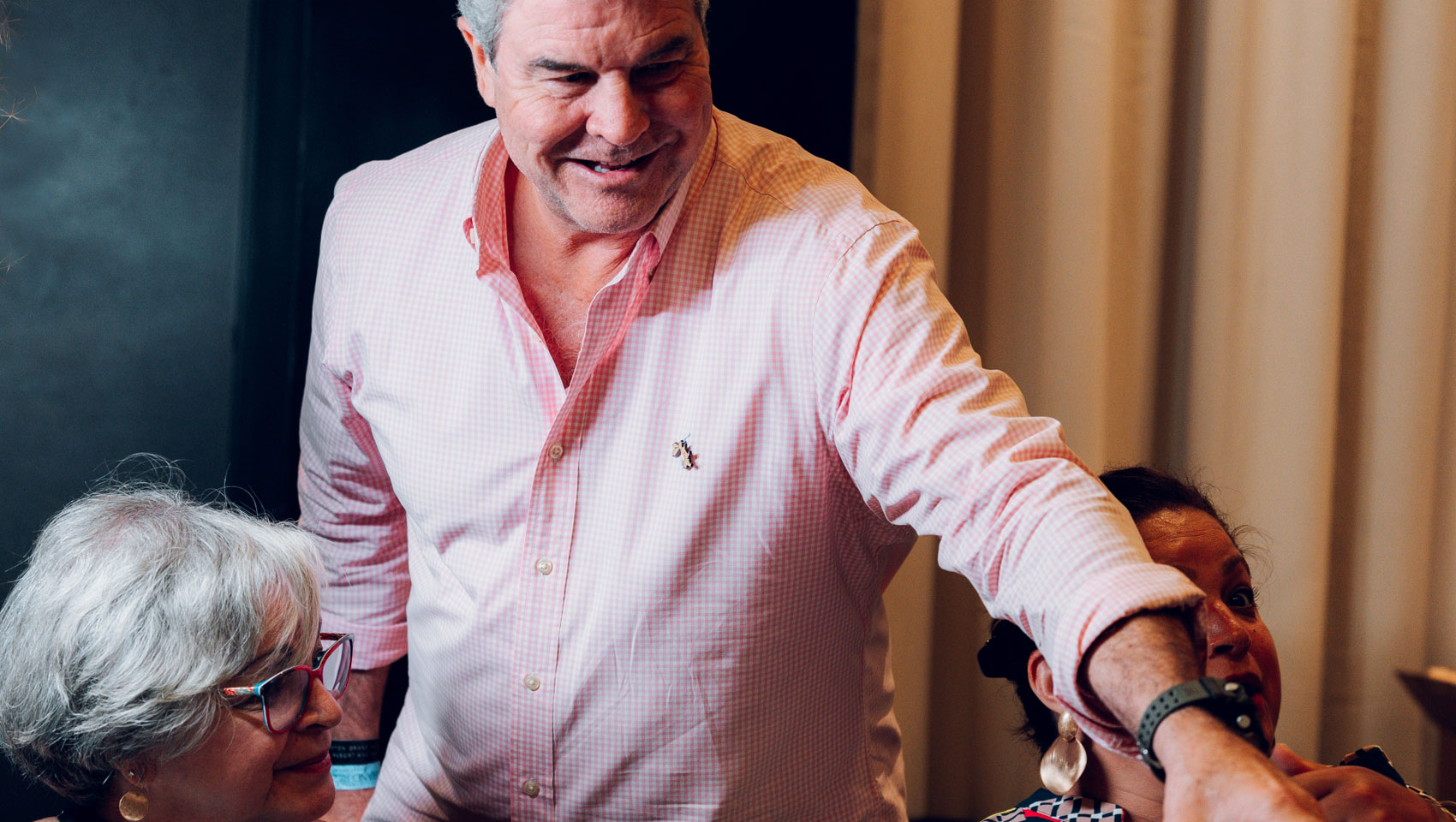 Guests being served wine at Grand Roatan Food & Wine Festival