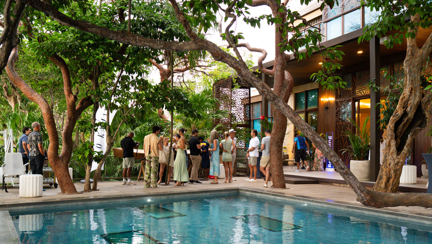 Guests mingle at Kimpton Grand Roatan Wellness Retreat 2026