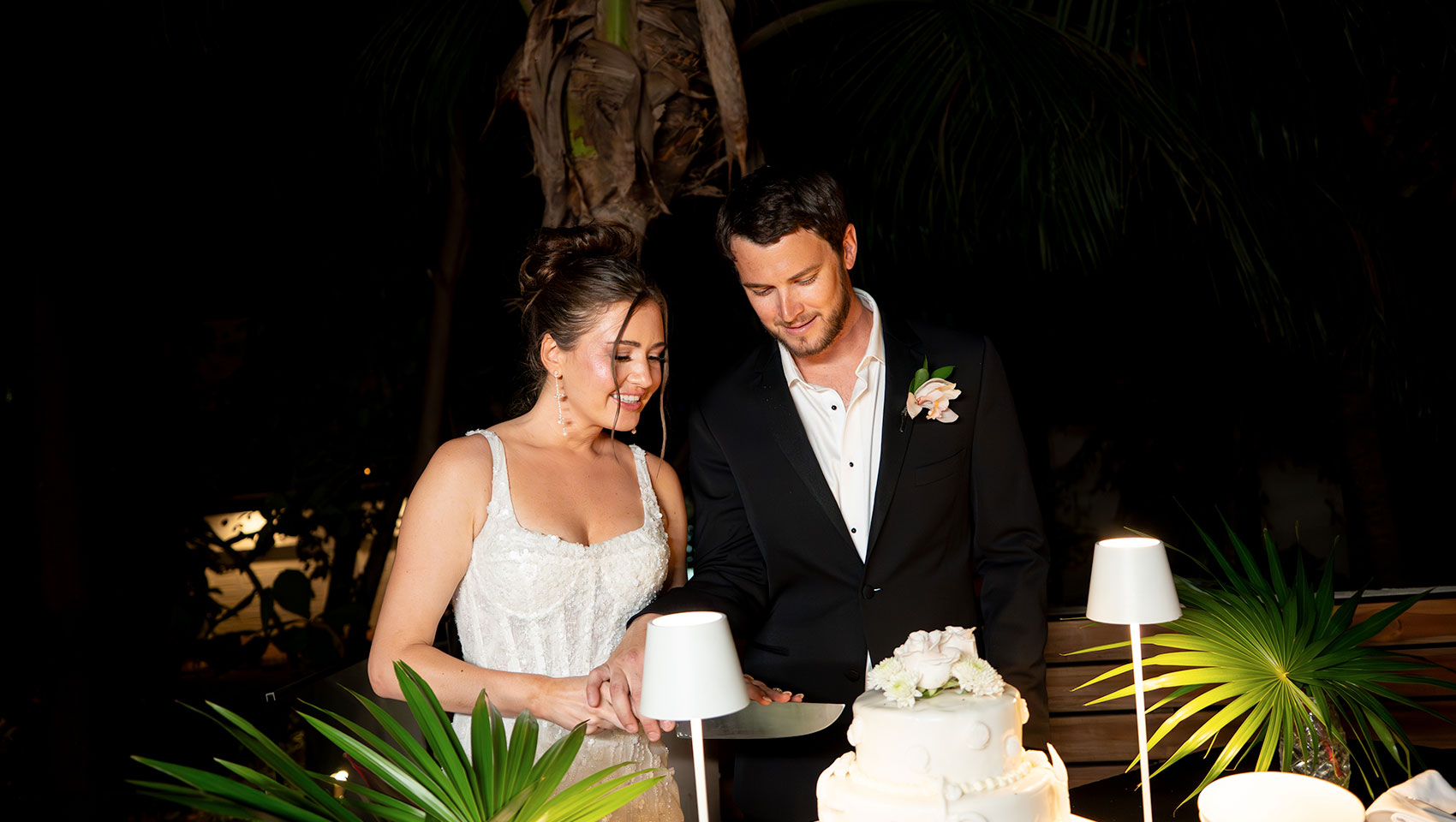 newlyweds cut cake