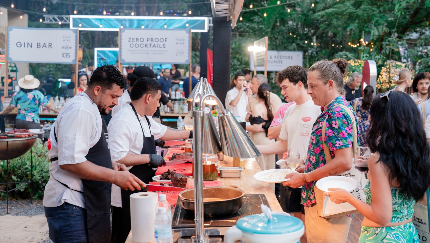 Guests are served at food booths at Grand Roatan Food & Wine Festival