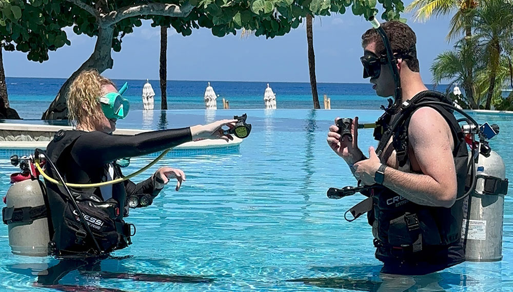 Man learning scuba in Grand Roatan pool