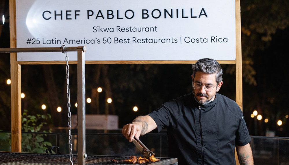 Chef Pablo Bonilla cooking in his booth