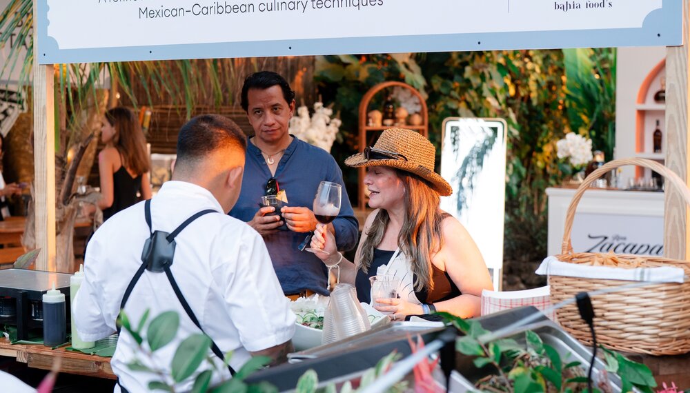 Chef Salvador Casalola Finest Seafood Experience booth Roatan at Food & Wine Festival