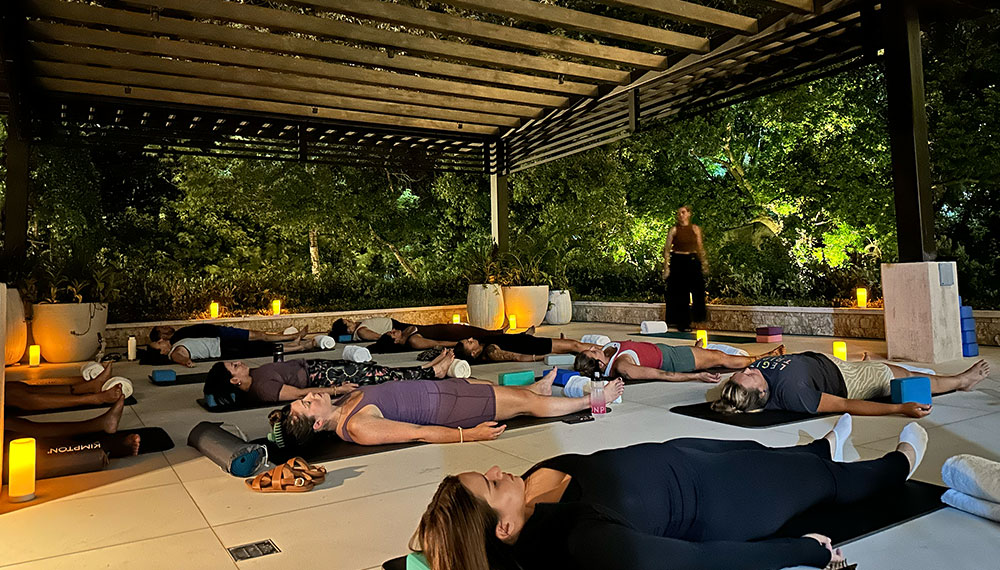 people laying down doing yoga