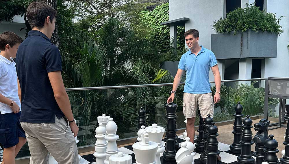 dad tosses child up in pool