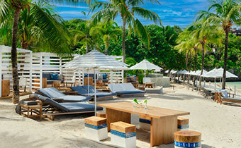 Cabanas, beach loungers, table and more