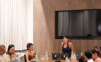 woman leading a class in a Grand Roatan boardroom