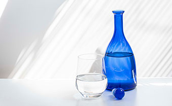 blue bottle glass of water