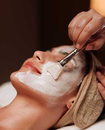 Woman Receives Facial