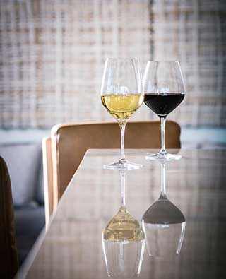 2 glasses of wine, one red, one white, at Vos Cafe