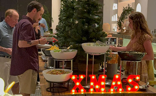 guests enjoying a buffet dinner at Alera on Christmas eve